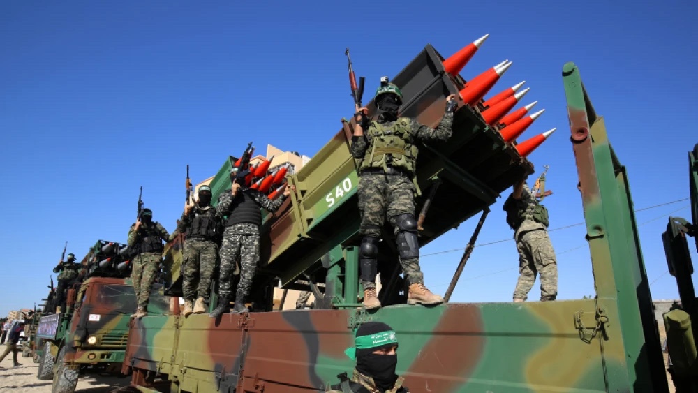 Hamas terrorists parade with Kalashnikov rifles and an eight-tube S-40 surface-to-surface rocket launcher with a claimed range of about 25 miles in Khan Yunis, the southern Gaza Strip, on May 27, 2021. Photo by Abed Rahim Khatib/Flash90.