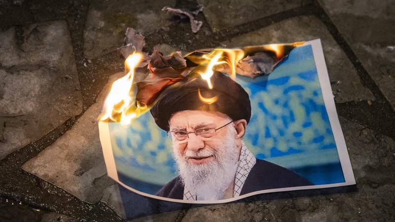 Photos of former Iranian Supreme Leader Ali Khamenei are burned at a Tel Aviv protest just one month before he was eliminated in an Israeli airstrike. Photo by Chaim Goldberg/Flash90