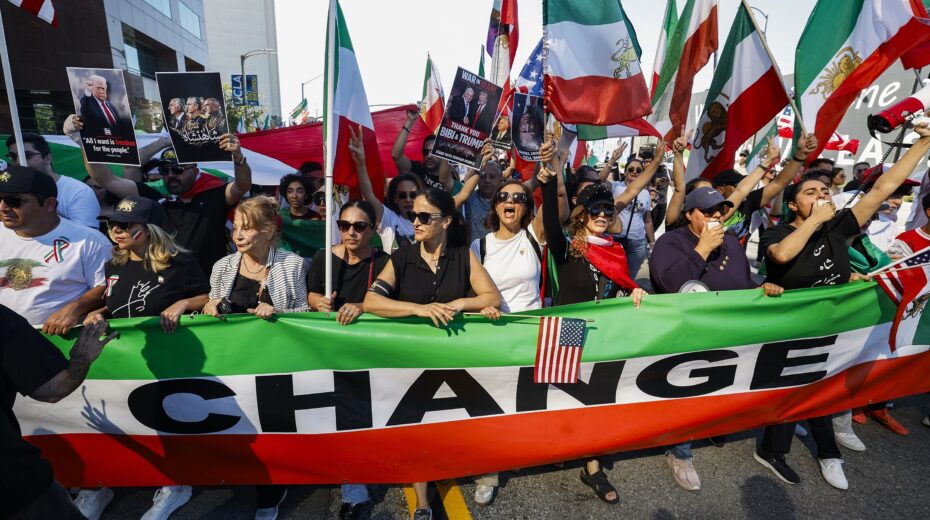 Demonstrators wave Iranian flags at a rally in Los Angeles, February 28, 2026. Photo: Chris Torres/EPA