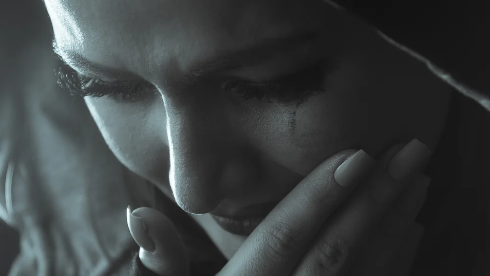 A woman crying. Credit: Pixabay.