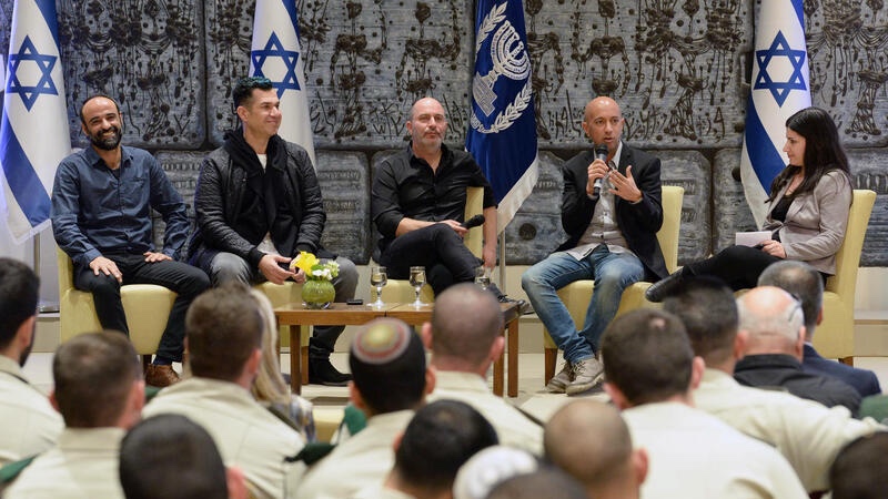 Stars of the Israeli television series "Fauda" speak to journalists at the President's Residence in Jerusalem. Photo by Mark Neyman/GPO