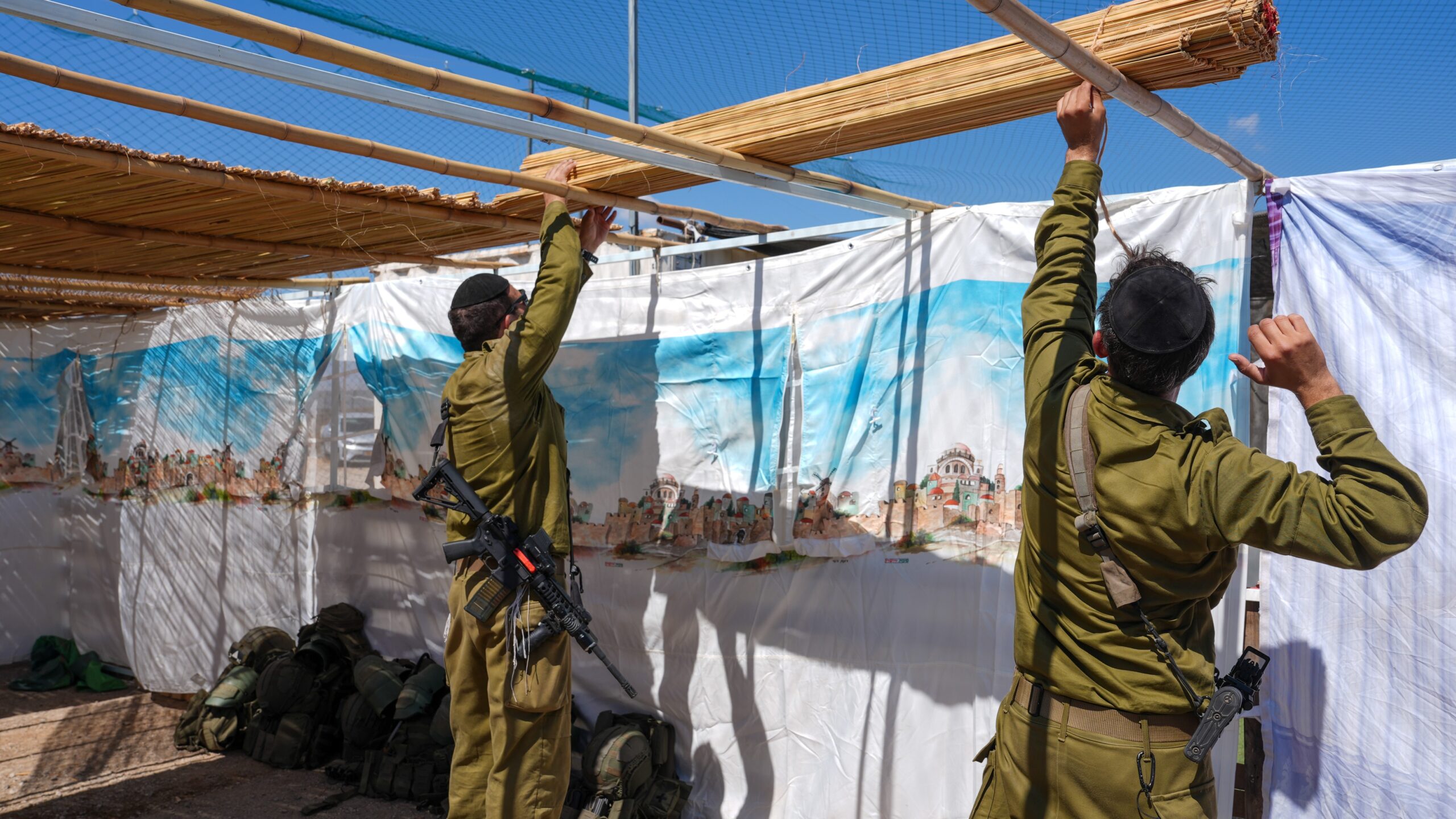 Israeli reservists from the ultra-Orthodox Hasmonean Brigade erect a sukkah for the Feast of Tabernacles at a military post in Syria near the Israeli border, September 24, 2026. Photo: Ayal Margolin/Flash90