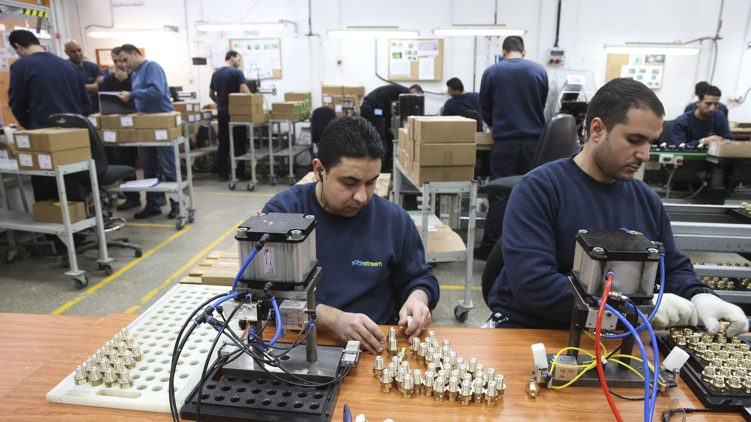 Palestinian workers in the former SodaStream factory near Maale Adumim. After the relocation of production to the Negev, hundreds lost their jobs. Photo: Nati Shohat/Flash90, February 2, 2014.