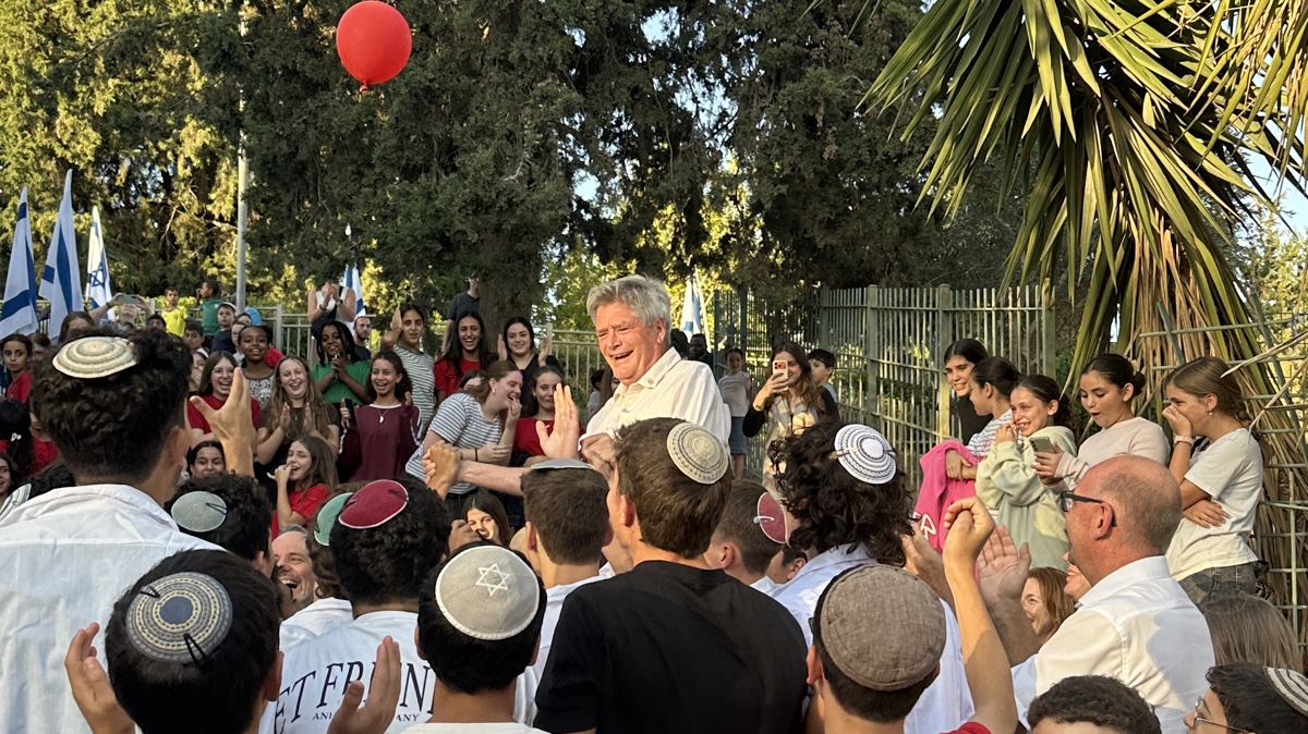 Roger van Oordt is lifted up onto the shoulders of Jerusalem's youth. Photo by Ryan Jones